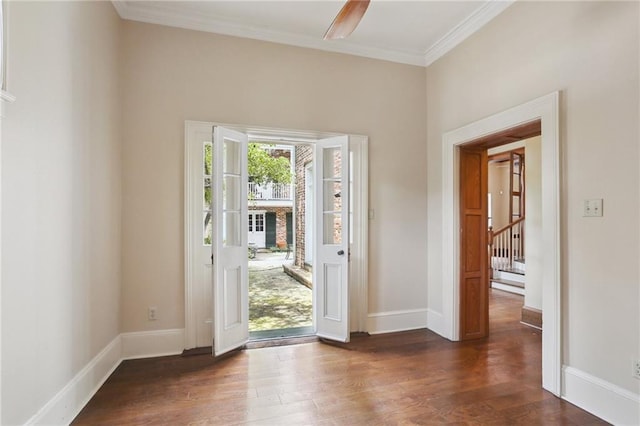 1124 Barracks St, New Orleans, LA 70116 - foyer entrance with dark wood-style floors, ornamental molding, and stairs