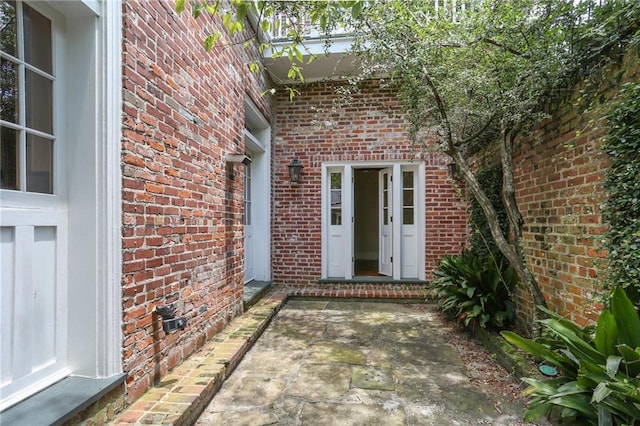 1124 Barracks St, New Orleans, LA 70116 - property entrance with brick siding and a patio area