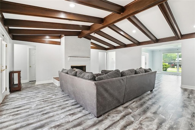 4400 Cleveland Pl, Metairie, LA 70003 - living area featuring wood finished floors, a fireplace, and recessed lighting