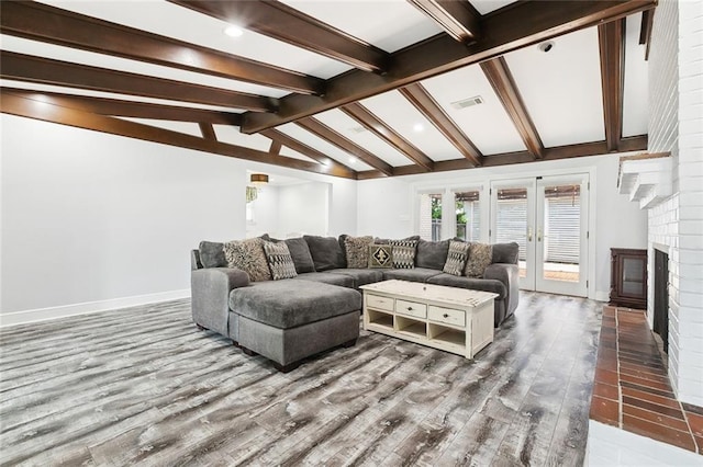 4400 Cleveland Pl, Metairie, LA 70003 - living area with wood finished floors, a brick fireplace, and recessed lighting