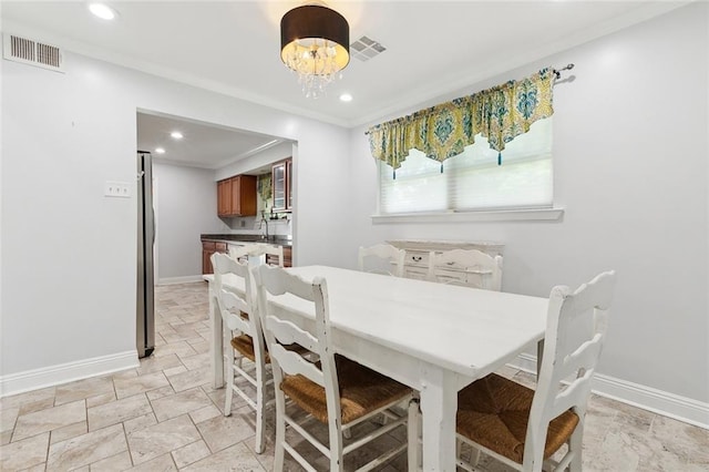 4400 Cleveland Pl, Metairie, LA 70003 - dining area featuring recessed lighting, a chandelier, and ornamental molding