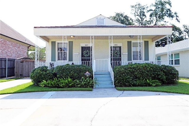 30507 Labarre Dr, Metairie, LA 70001 - view of front of property featuring covered porch and stucco siding