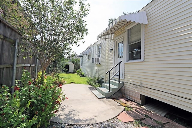 30507 Labarre Dr, Metairie, LA 70001 - view of patio featuring entry steps, cooling unit, and a storage shed