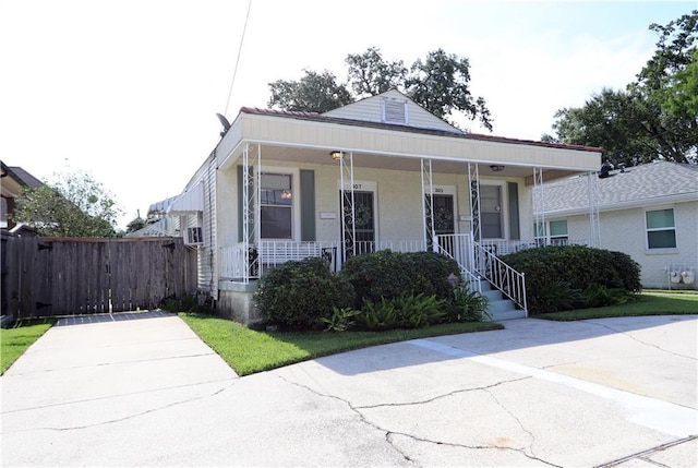 30507 Labarre Dr, Metairie, LA 70001 - view of front of home with a porch and stucco siding