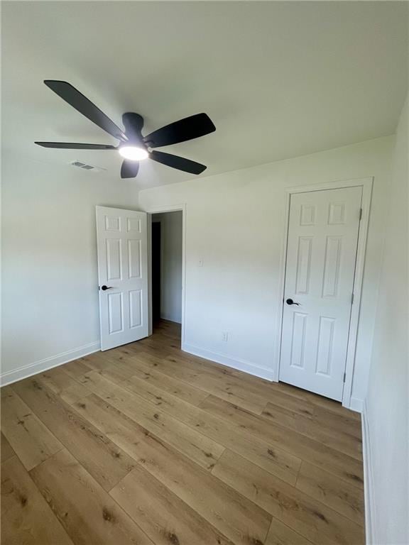 144 Yvonne Dr, Avondale, LA 70094 - unfurnished bedroom featuring light wood-style flooring and a ceiling fan