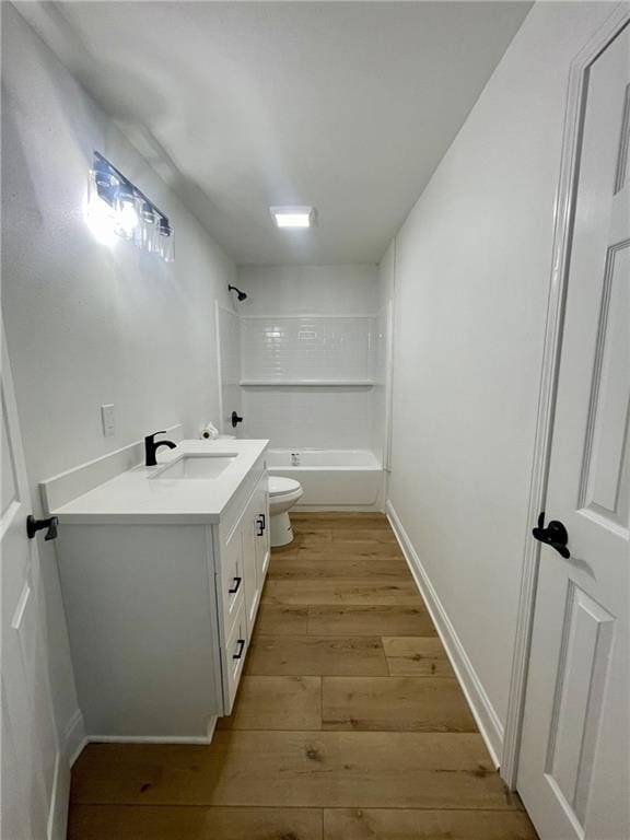 144 Yvonne Dr, Avondale, LA 70094 - bathroom with vanity, hardwood / wood-style flooring, and shower / tub combination