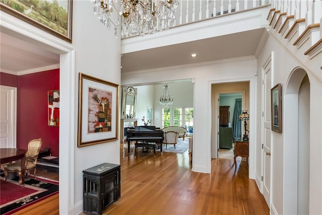 15 Muirfield Pl, New Orleans, LA 70131 - corridor with a chandelier, wood finished floors, crown molding, and a high ceiling
