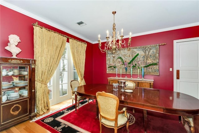 15 Muirfield Pl, New Orleans, LA 70131 - dining area with a chandelier, crown molding, and wood finished floors
