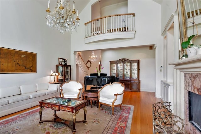15 Muirfield Pl, New Orleans, LA 70131 - living area with a chandelier, a high ceiling, wood finished floors, and a premium fireplace