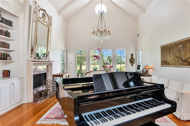 15 Muirfield Pl, New Orleans, LA 70131 - sitting room featuring light wood-style flooring, a chandelier, high vaulted ceiling, a premium fireplace, and beamed ceiling