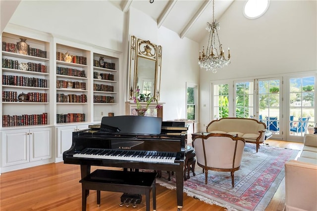 15 Muirfield Pl, New Orleans, LA 70131 - sitting room with a chandelier, light wood-type flooring, high vaulted ceiling, french doors, and beam ceiling