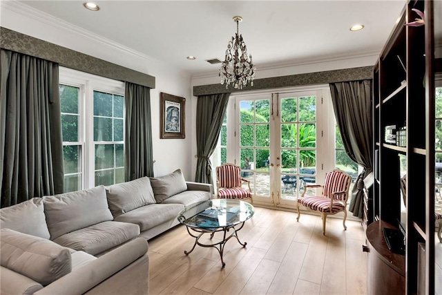 15 Muirfield Pl, New Orleans, LA 70131 - living room with healthy amount of natural light, wood finished floors, a chandelier, ornamental molding, and recessed lighting