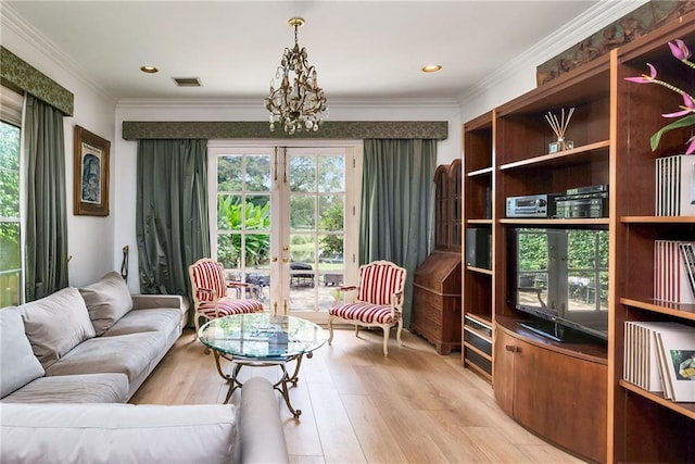 15 Muirfield Pl, New Orleans, LA 70131 - living room featuring french doors, light wood-style flooring, crown molding, a chandelier, and recessed lighting