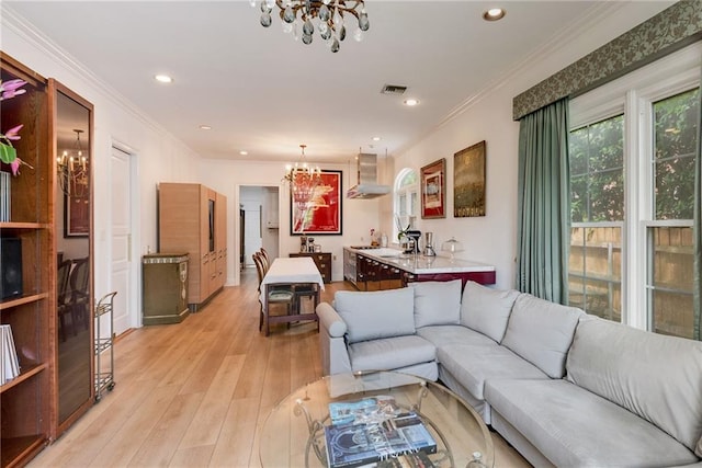 15 Muirfield Pl, New Orleans, LA 70131 - living area featuring a chandelier, light wood-style floors, ornamental molding, and recessed lighting