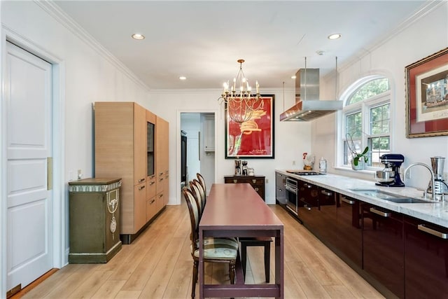 15 Muirfield Pl, New Orleans, LA 70131 - kitchen featuring wall chimney range hood, crown molding, stainless steel oven, light wood-type flooring, and a chandelier