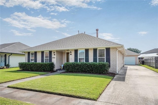 4152 Cognac Dr, Kenner, LA 70065 - view of front of property with brick siding, a detached garage, and a shingled roof