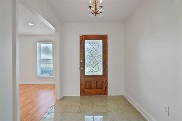 4152 Cognac Dr, Kenner, LA 70065 - entrance foyer with a chandelier and baseboards