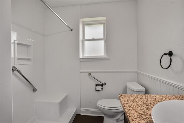 4152 Cognac Dr, Kenner, LA 70065 - bathroom with a wainscoted wall, a shower, and vanity