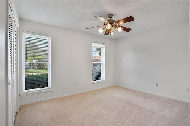 4152 Cognac Dr, Kenner, LA 70065 - unfurnished room featuring ceiling fan, a textured ceiling, and light colored carpet