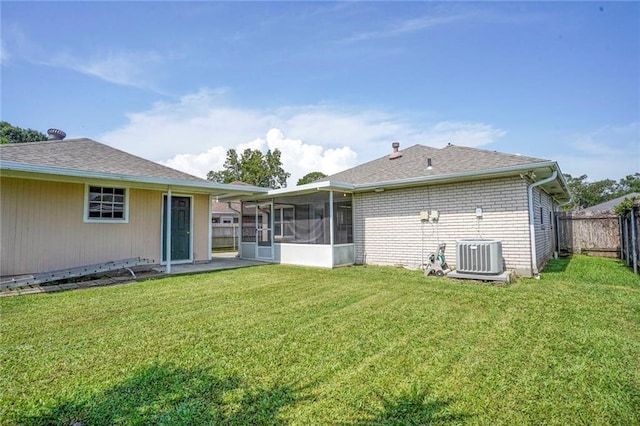 4152 Cognac Dr, Kenner, LA 70065 - back of property with a sunroom, a fenced backyard, brick siding, and roof with shingles