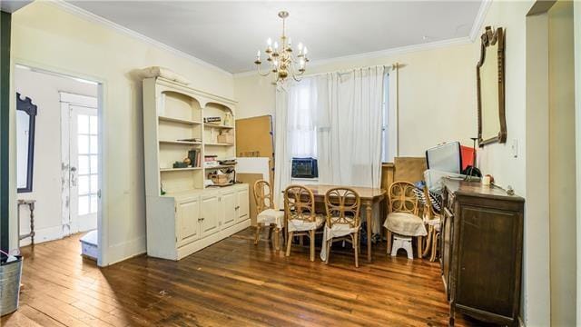 4429-31 Eden Ln, New Orleans, LA 70125 - dining room with crown molding, a chandelier, and dark wood-style floors