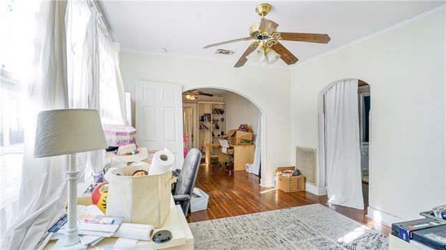 4429-31 Eden Ln, New Orleans, LA 70125 - bedroom with arched walkways, ornamental molding, wood finished floors, and ceiling fan