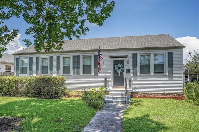 4717 Orleans Blvd, Jefferson, LA 70121 - bungalow-style home featuring a front lawn and a shingled roof