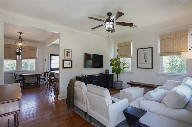 4717 Orleans Blvd, Jefferson, LA 70121 - living area featuring dark wood-style floors, ceiling fan, and a chandelier