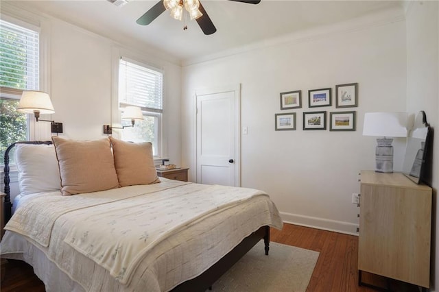 4717 Orleans Blvd, Jefferson, LA 70121 - bedroom featuring dark wood-style floors, crown molding, and a ceiling fan