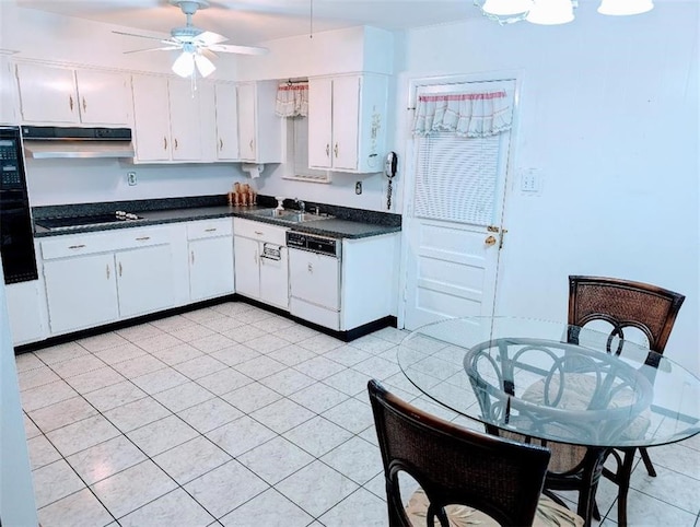 1116 Carnation Ave, Metairie, LA 70001 - kitchen featuring white dishwasher, ceiling fan, dark countertops, white cabinetry, and under cabinet range hood