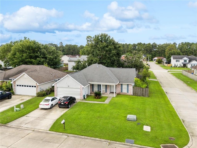 1702 Barrymore St, Slidell, LA 70461 - ranch-style house featuring a garage, a front lawn, driveway, and a residential view
