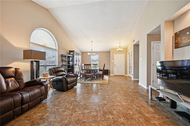 1702 Barrymore St, Slidell, LA 70461 - living area with a chandelier, lofted ceiling, and a textured ceiling