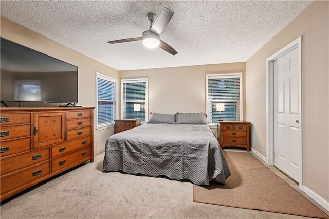 1702 Barrymore St, Slidell, LA 70461 - bedroom featuring a textured ceiling, light colored carpet, and a ceiling fan