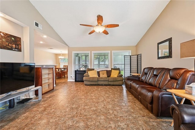 1702 Barrymore St, Slidell, LA 70461 - living room featuring a ceiling fan, a chandelier, and high vaulted ceiling