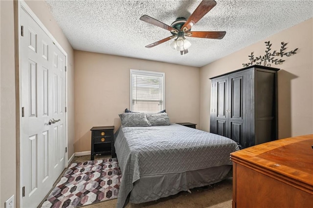 1702 Barrymore St, Slidell, LA 70461 - carpeted bedroom with a textured ceiling and a ceiling fan