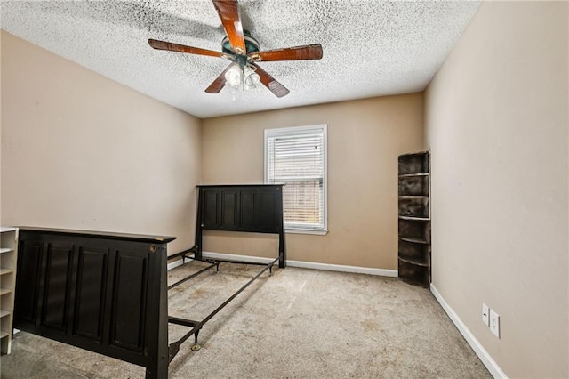 1702 Barrymore St, Slidell, LA 70461 - unfurnished bedroom with light colored carpet, a textured ceiling, and a ceiling fan