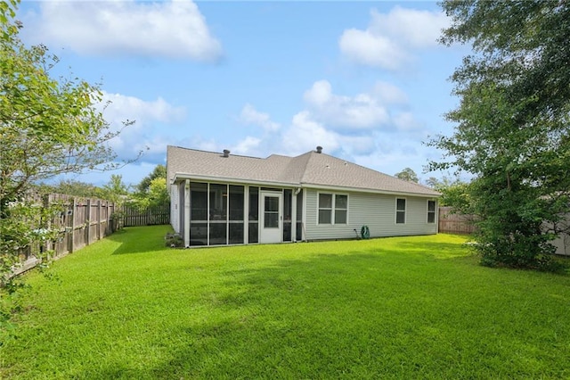 1702 Barrymore St, Slidell, LA 70461 - rear view of property with a sunroom, a fenced backyard, and a shingled roof