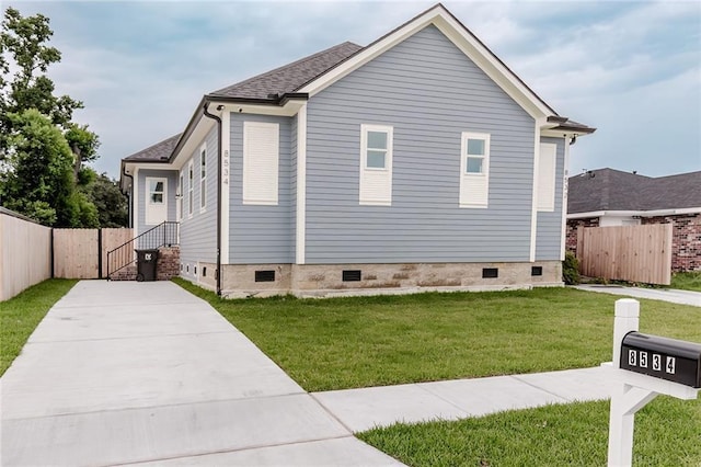 8532 Regiment Dr, Chalmette, LA 70043 - view of property exterior featuring crawl space, driveway, and roof with shingles