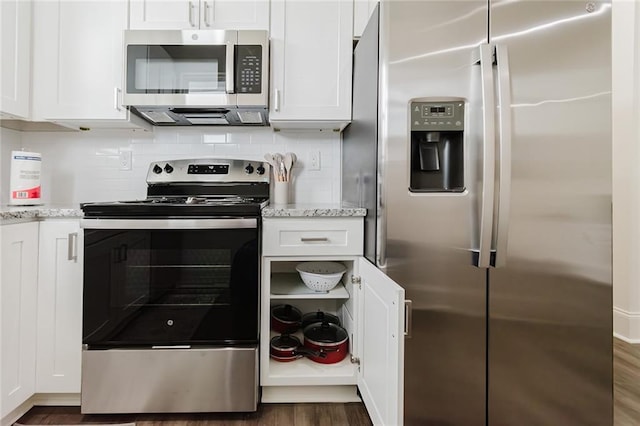 8532 Regiment Dr, Chalmette, LA 70043 - kitchen featuring stainless steel appliances, white cabinetry, dark wood-style flooring, and backsplash