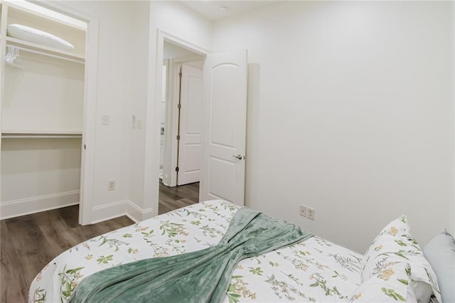 8532 Regiment Dr, Chalmette, LA 70043 - bedroom with dark wood-style floors, a closet, and a spacious closet