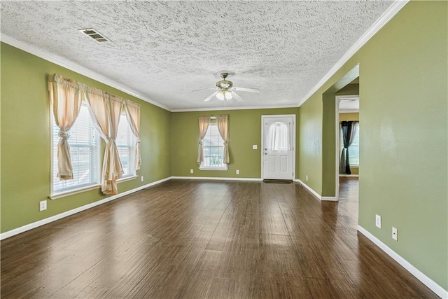4850 Pauline Dr, New Orleans, LA 70126 - unfurnished room featuring ceiling fan, dark wood-type flooring, ornamental molding, and a textured ceiling
