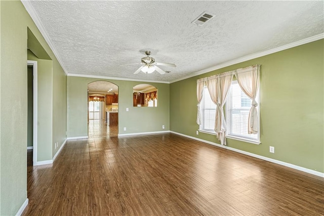 4850 Pauline Dr, New Orleans, LA 70126 - unfurnished living room featuring ceiling fan, arched walkways, wood finished floors, a textured ceiling, and ornamental molding