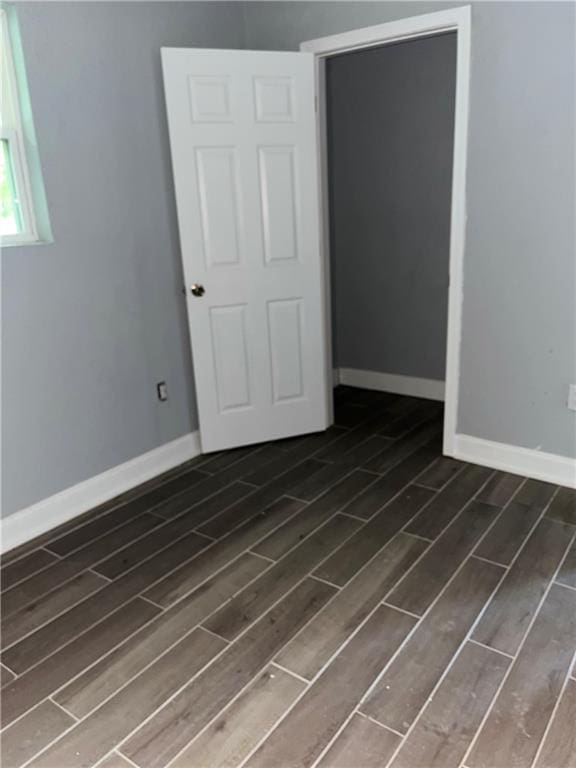 184143 Gordon St, New Orleans, LA 70117 - empty room featuring wood finished floors and baseboards