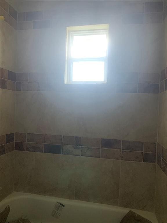 184143 Gordon St, New Orleans, LA 70117 - bathroom featuring a tub and a shower