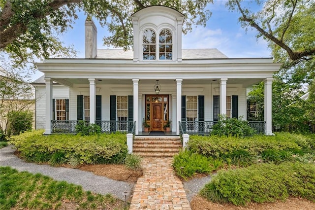 52 Tokalon Pl, Metairie, LA 70001 - neoclassical home with a porch and a chimney
