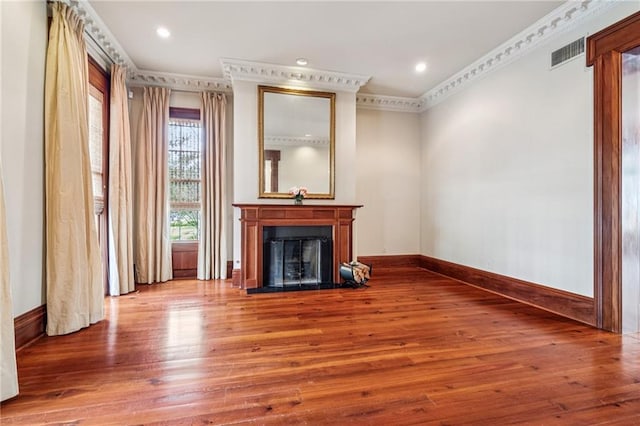 52 Tokalon Pl, Metairie, LA 70001 - unfurnished living room featuring wood finished floors, a fireplace with flush hearth, crown molding, and recessed lighting