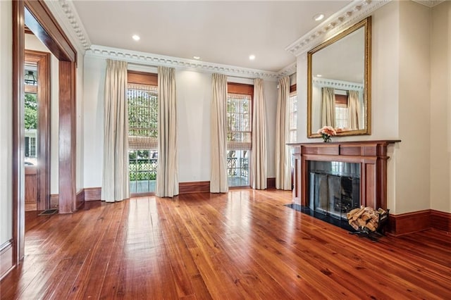 52 Tokalon Pl, Metairie, LA 70001 - unfurnished living room featuring hardwood / wood-style floors, a premium fireplace, ornamental molding, and recessed lighting