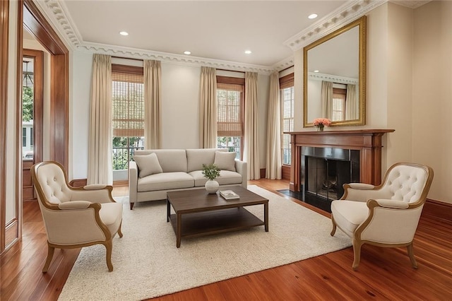 52 Tokalon Pl, Metairie, LA 70001 - sitting room featuring wood finished floors, healthy amount of natural light, a fireplace with flush hearth, crown molding, and recessed lighting