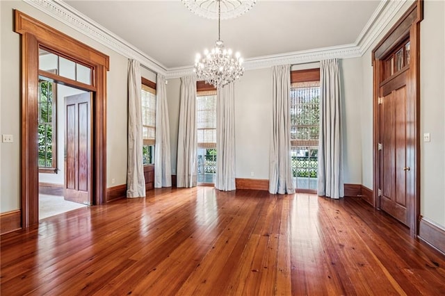 52 Tokalon Pl, Metairie, LA 70001 - empty room with a chandelier, hardwood / wood-style flooring, and ornamental molding