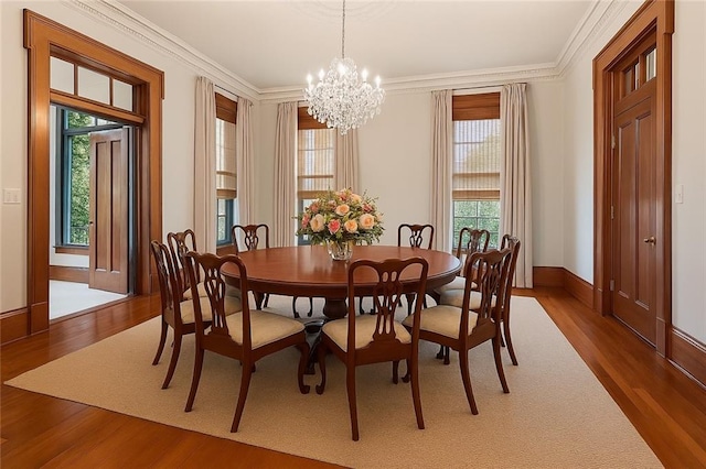 52 Tokalon Pl, Metairie, LA 70001 - dining area with wood finished floors, a chandelier, and ornamental molding